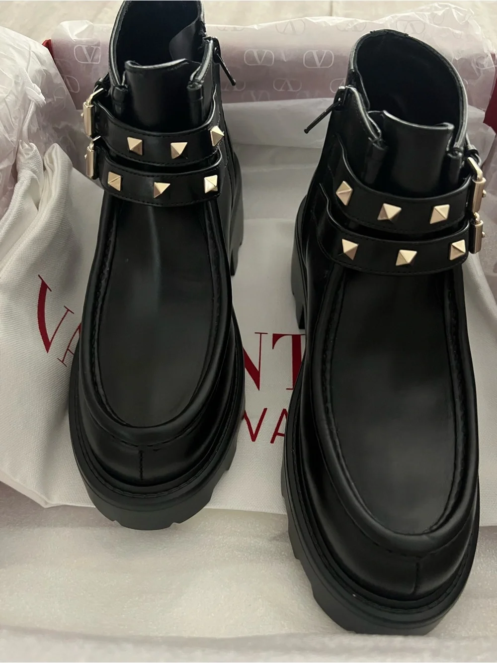 Valentino Garavani Black Leather Lug-Sole Ankle Boots with Studded Double Straps
